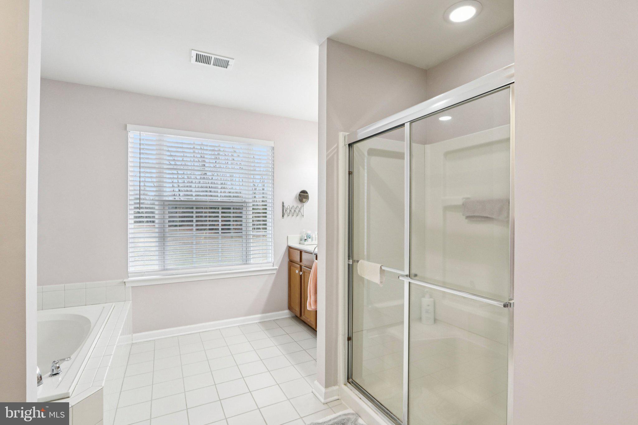 1 John's Way Bridgeton, NJ 08302 - Photo 42 of 57 a bathroom with a tub shower and a sink