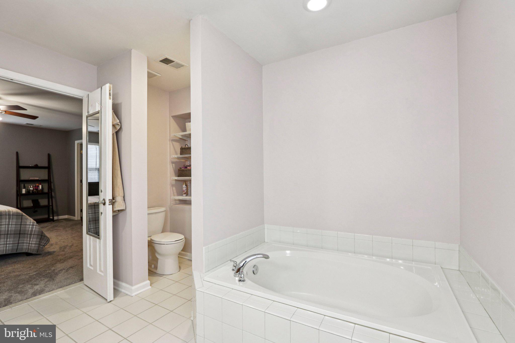 1 John's Way Bridgeton, NJ 08302 - Photo 43 of 57 a spacious bathroom with a bathtub and toilet
