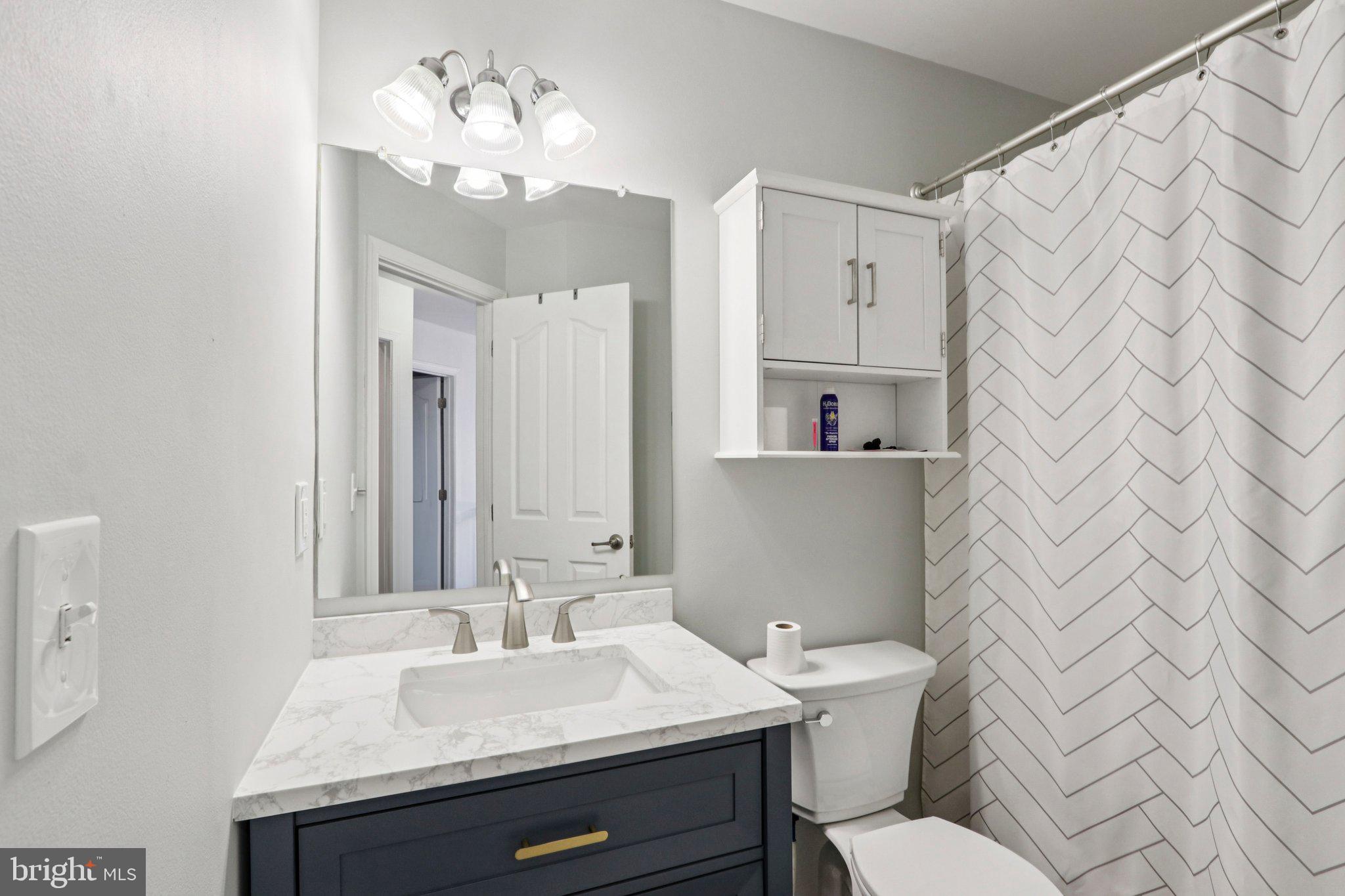 1 John's Way Bridgeton, NJ 08302 - Photo 45 of 57 a bathroom with a sink a toilet and mirror