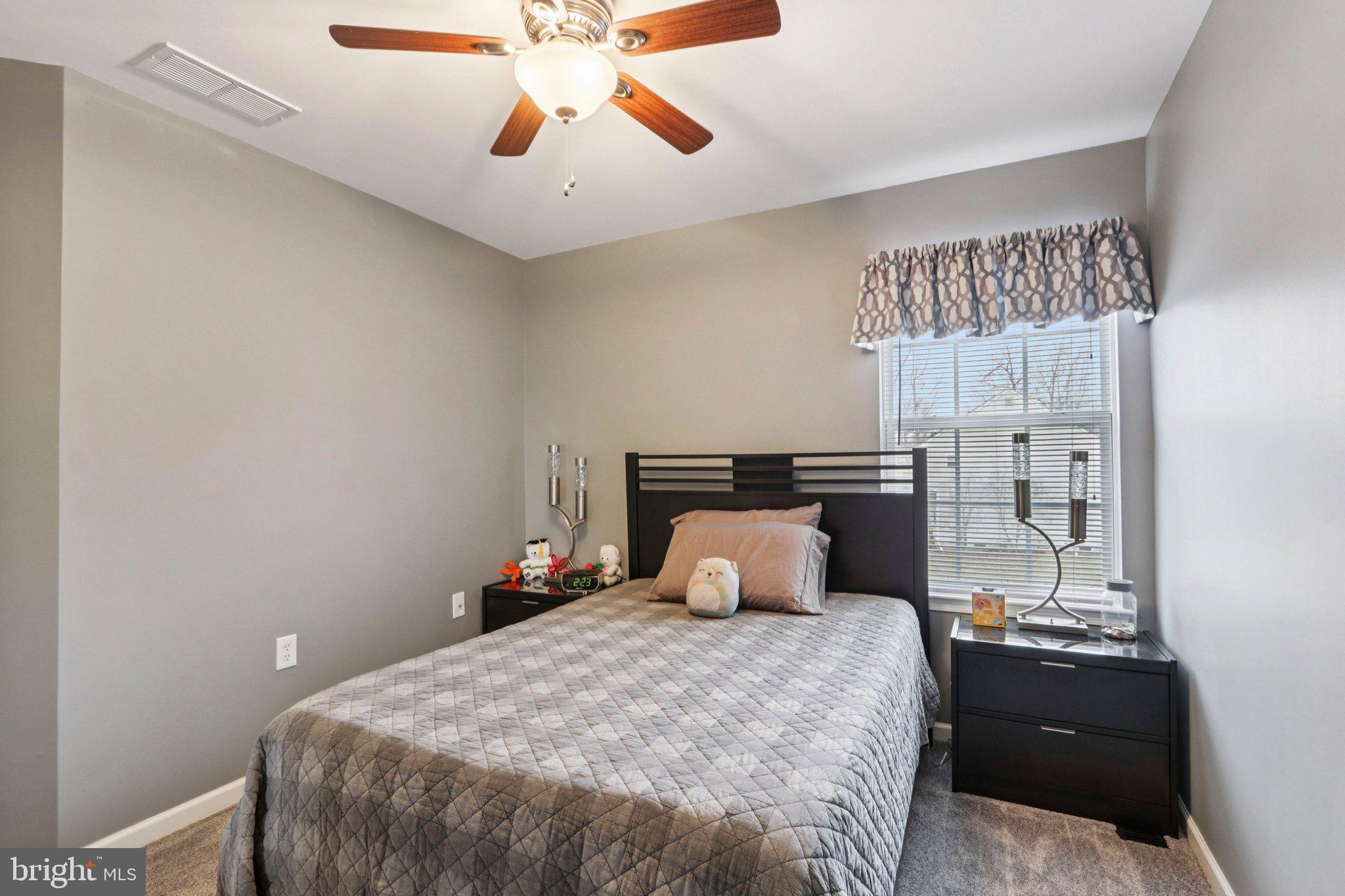 1 John's Way Bridgeton, NJ 08302 - Photo 51 of 57 a bedroom with a bed and wooden floor