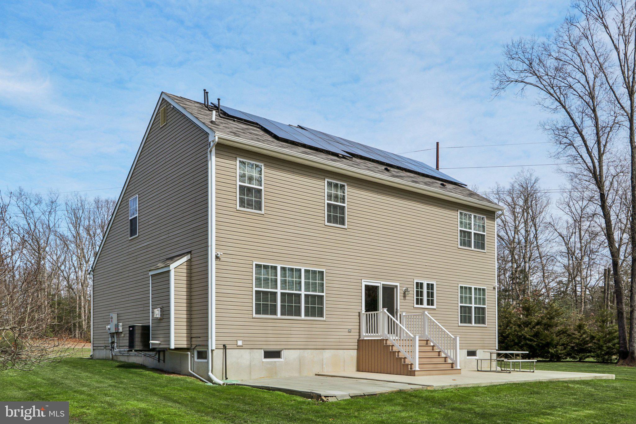 1 John's Way Bridgeton, NJ 08302 - Photo 6 of 57 a front view of a house with a garden and yard