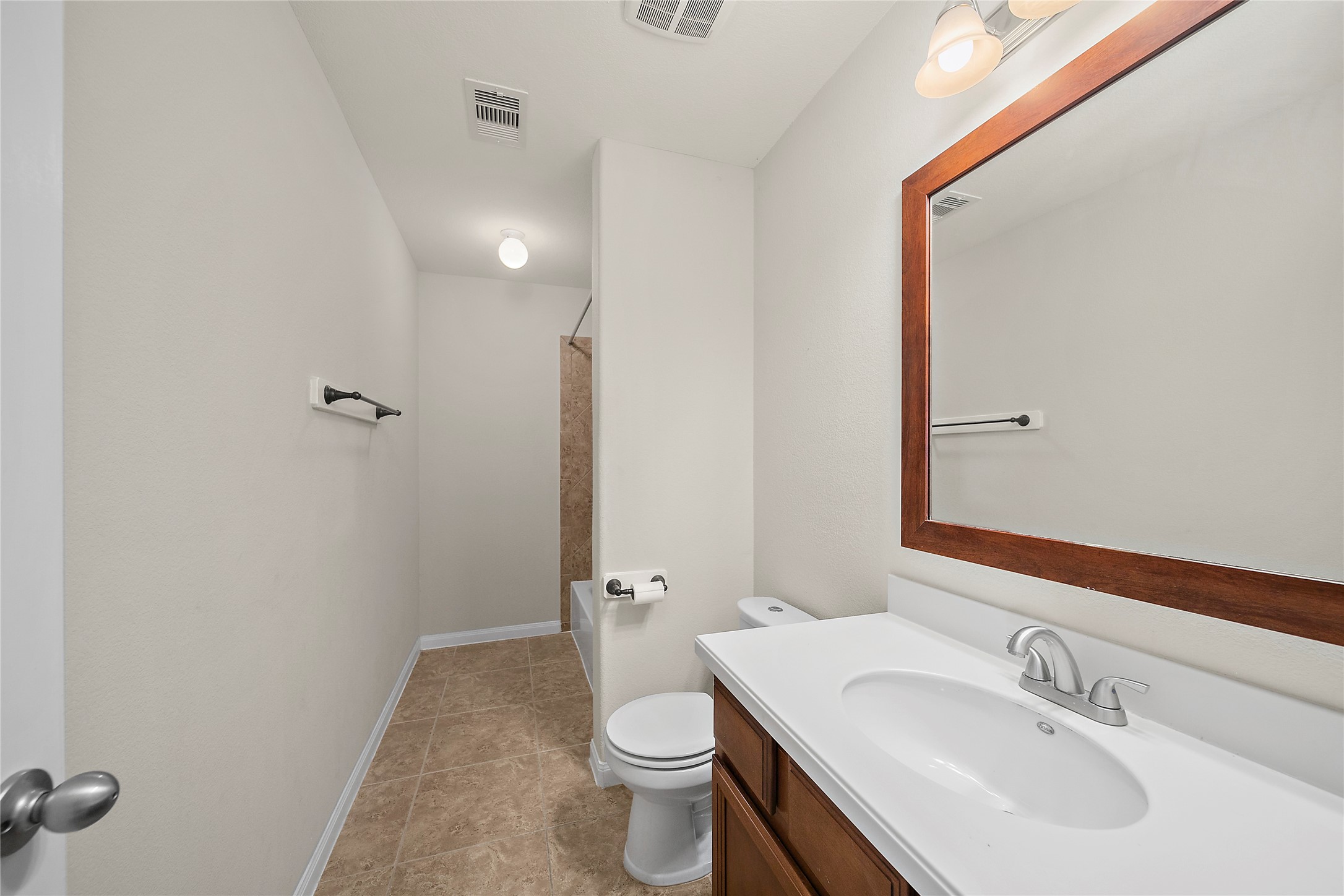 20215 Towering Cypress Drive Cypress, TX 77433 - Photo 18 of 27 a bathroom with a sink a toilet and shower