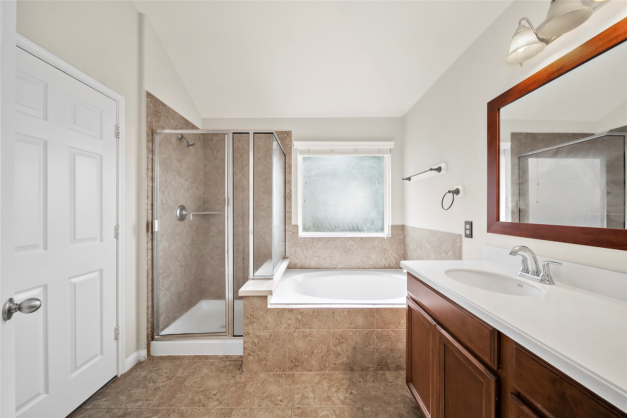 20215 Towering Cypress Drive Cypress, TX 77433 - Photo 20 of 27 a spacious bathroom with a shower sink and mirror