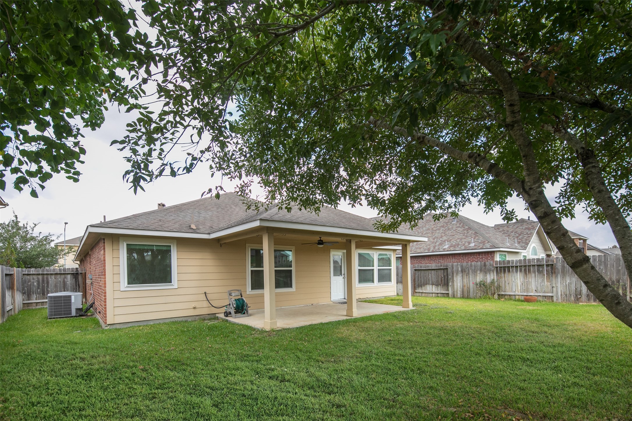 20215 Towering Cypress Drive Cypress, TX 77433 - Photo 27 of 27 a front view of a house with a garden and yard