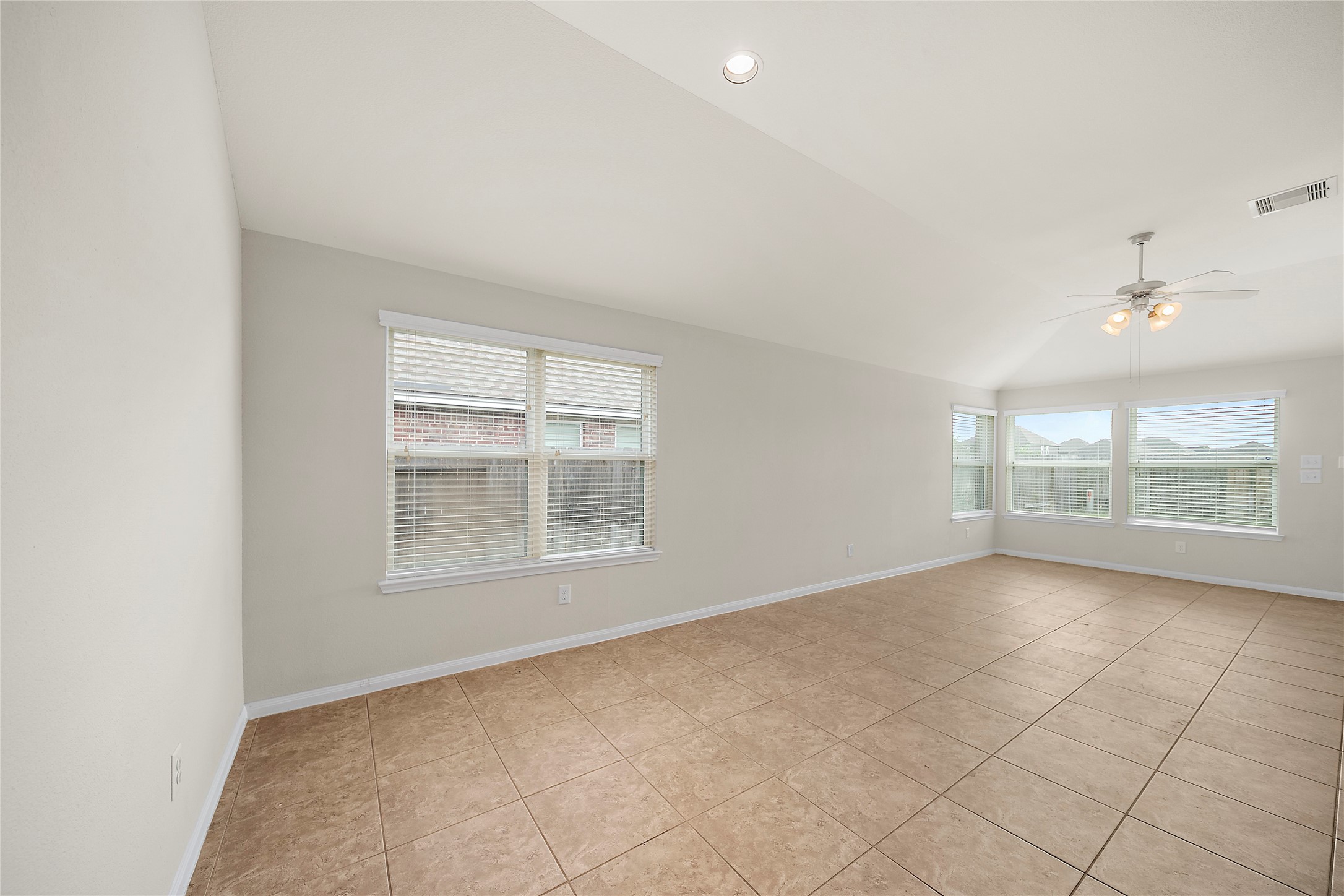 20215 Towering Cypress Drive Cypress, TX 77433 - Photo 8 of 27 an empty room with a empty space and windows