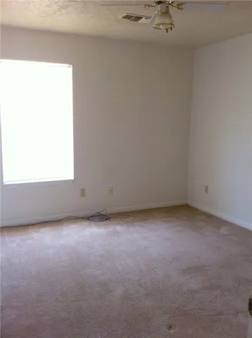 a view of a room that has a window in it