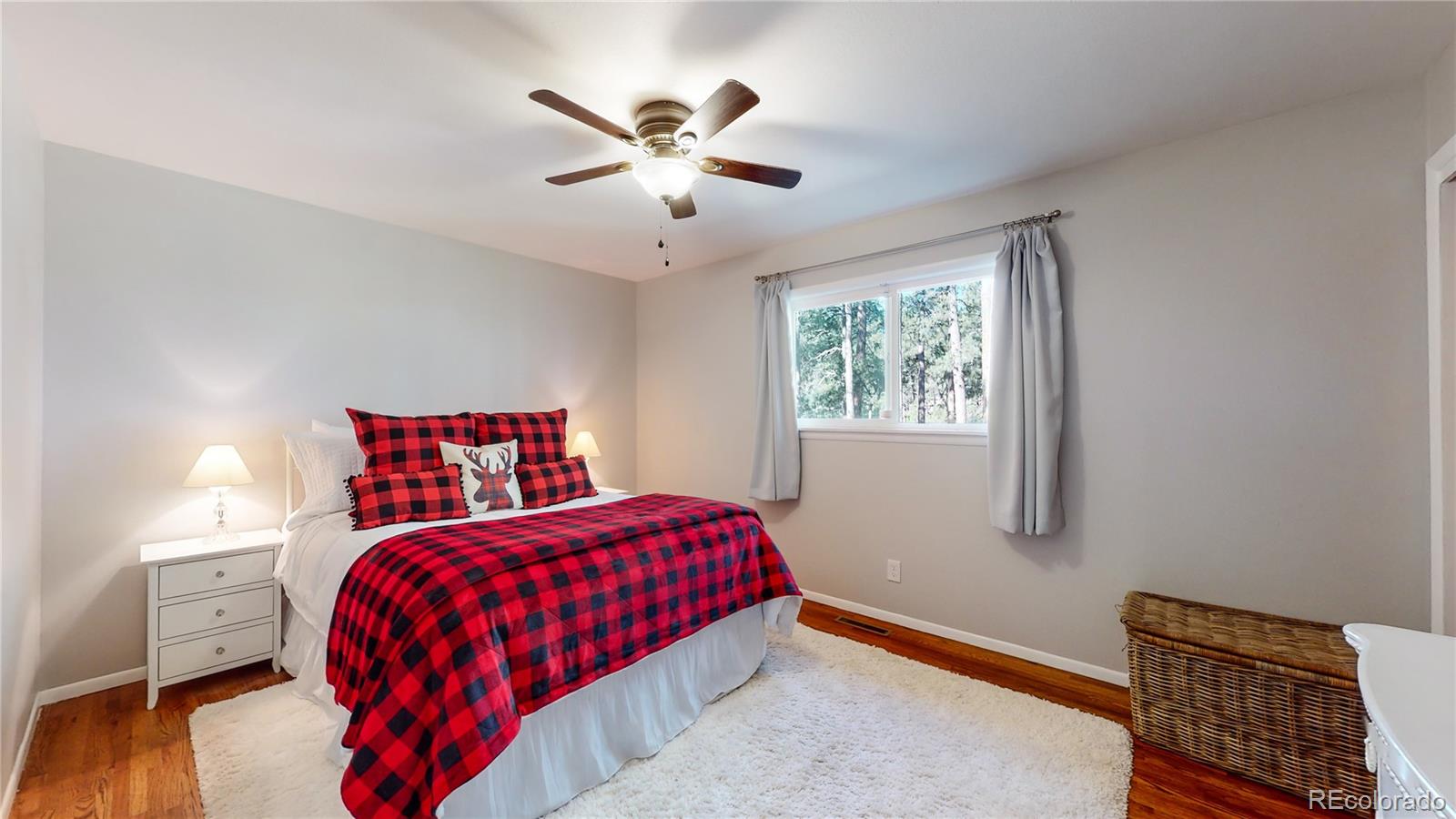 8020 Cyprus Road Colorado Springs, CO 80908 - Photo 18 of 42 a bedroom with a bed and window
