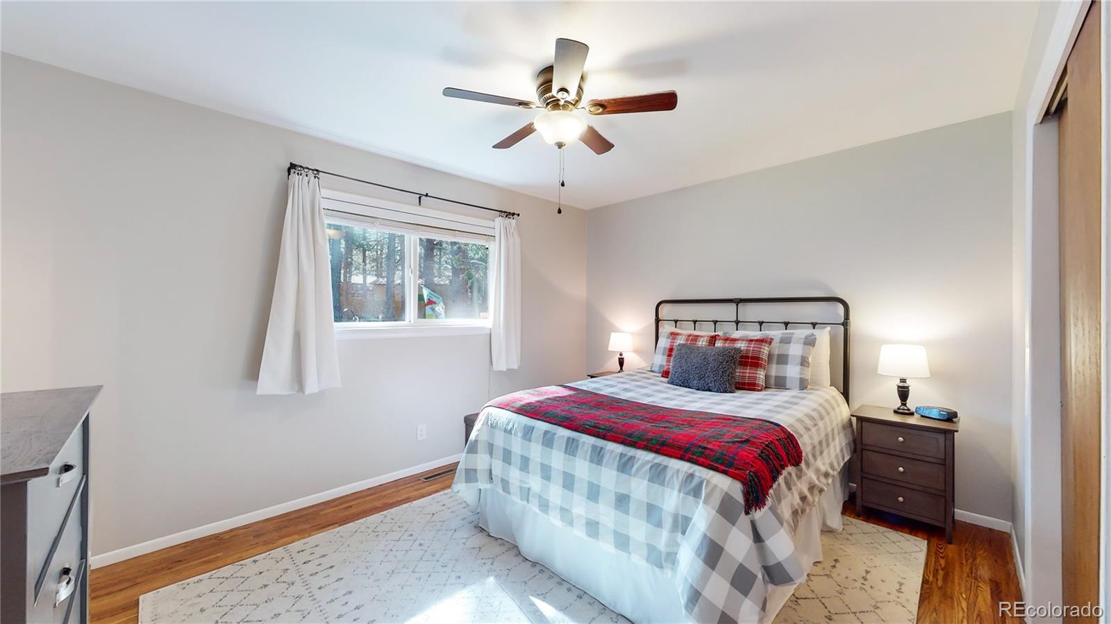 8020 Cyprus Road Colorado Springs, CO 80908 - Photo 20 of 42 a bedroom with a bed and a window