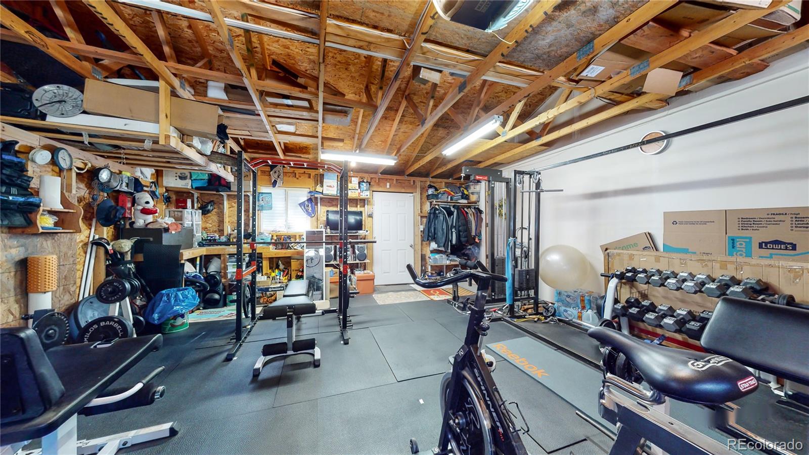 8020 Cyprus Road Colorado Springs, CO 80908 - Photo 32 of 42 a view of a room with gym equipment
