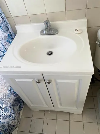 a bathroom with a sink and washing machine