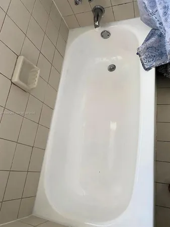 a bathroom with a white bathtub