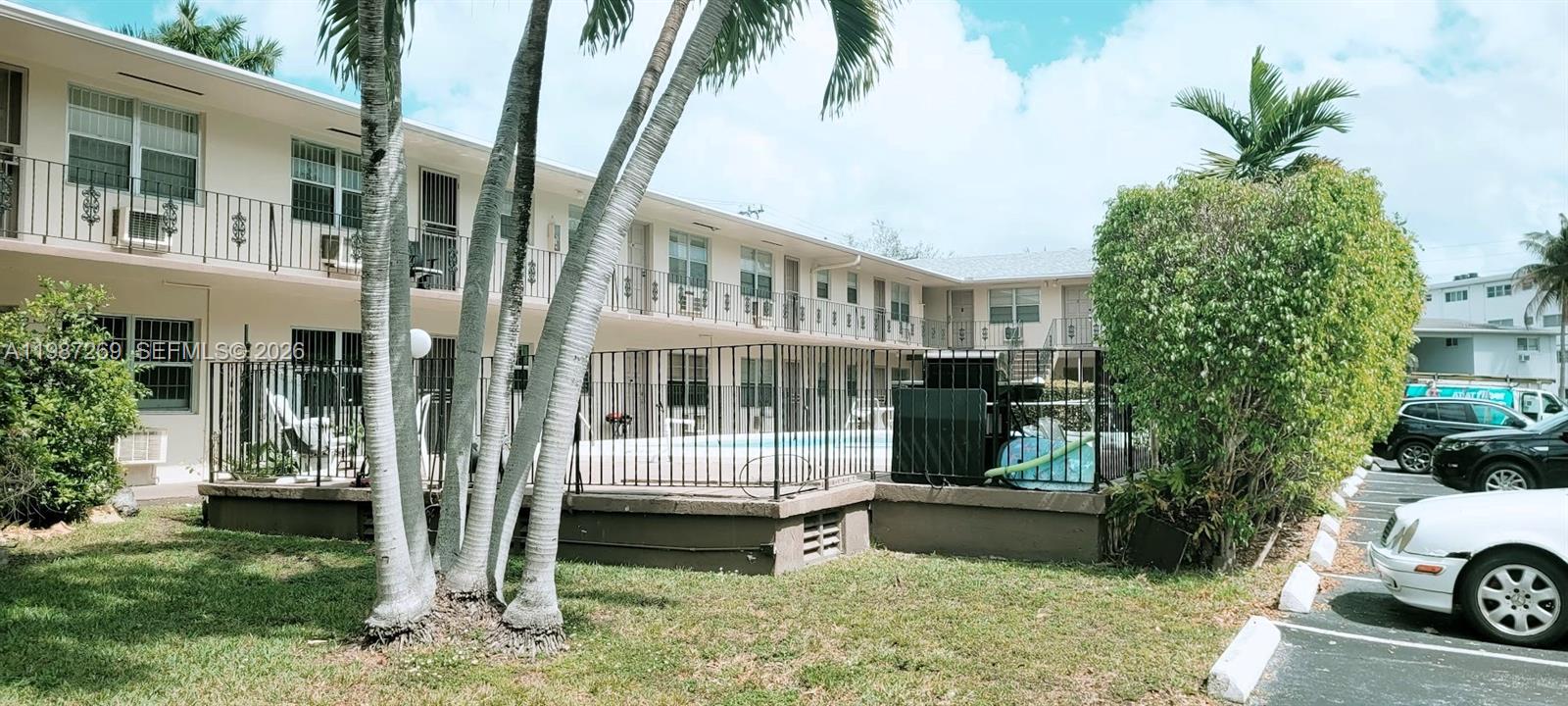 1755 Northeast 116th Road, Unit 8 North Miami, FL 33181 - Photo 18 of 23 a house view with a garden space