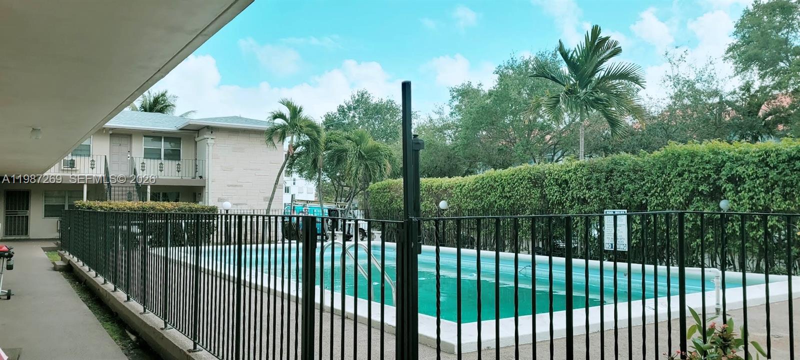 1755 Northeast 116th Road, Unit 8 North Miami, FL 33181 - Photo 19 of 23 a view of street from balcony