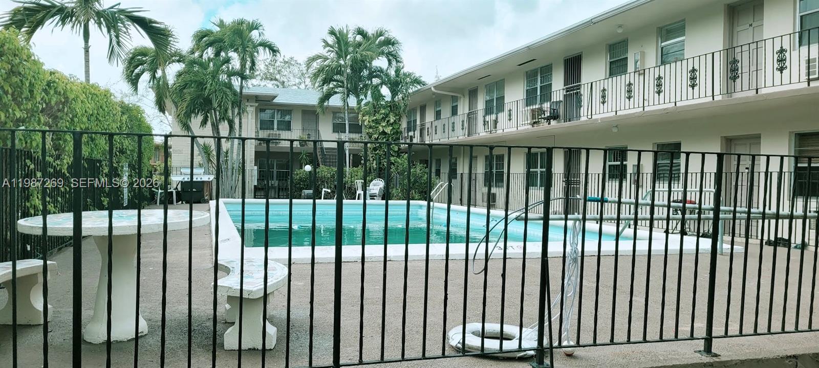 1755 Northeast 116th Road, Unit 8 North Miami, FL 33181 - Photo 21 of 23 a view of a balcony