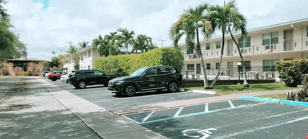 a view of street with parked cars