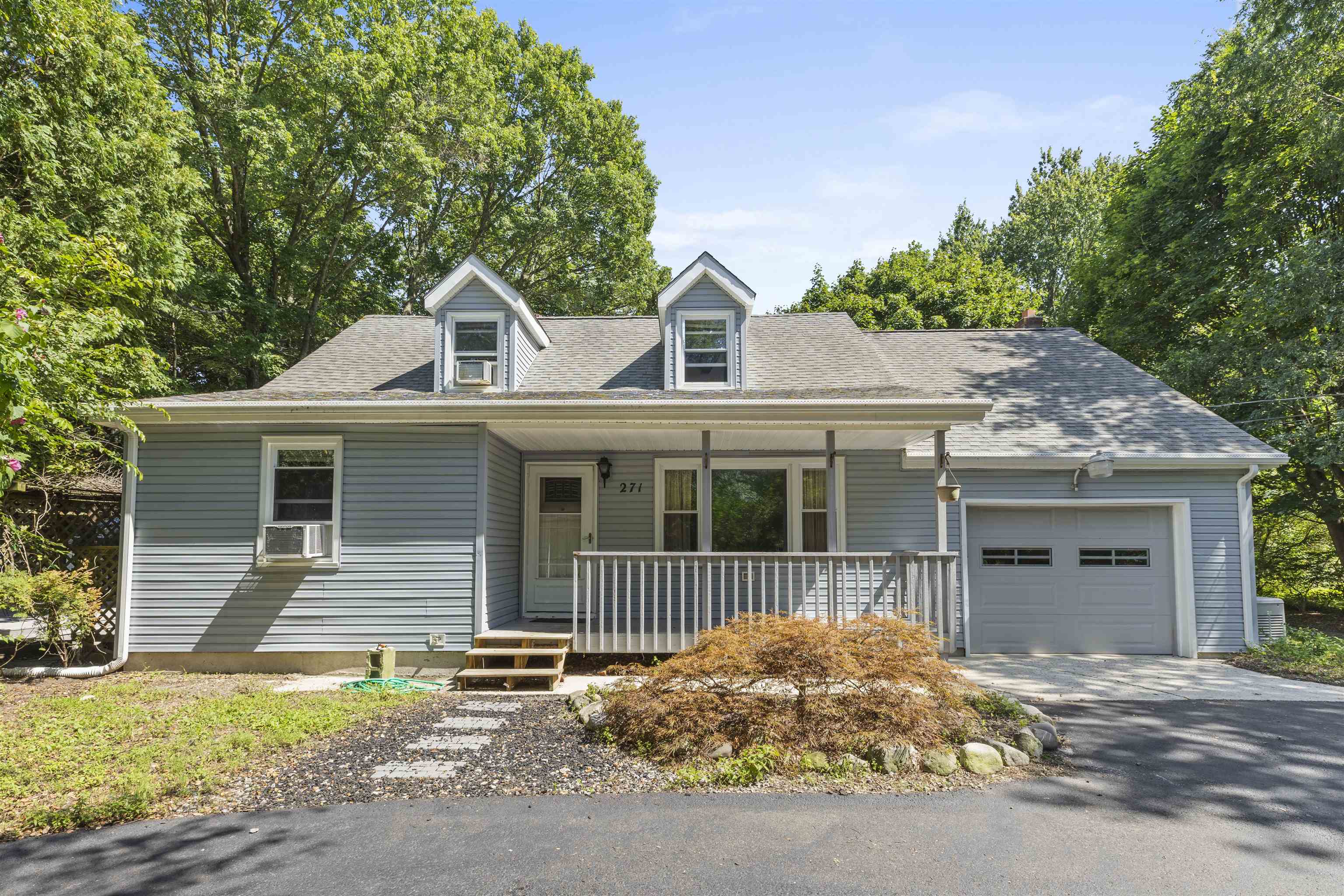 271 Hands Mill Road Belleplain, NJ 08270 - Photo 1 of 50 a front view of a house with a garage