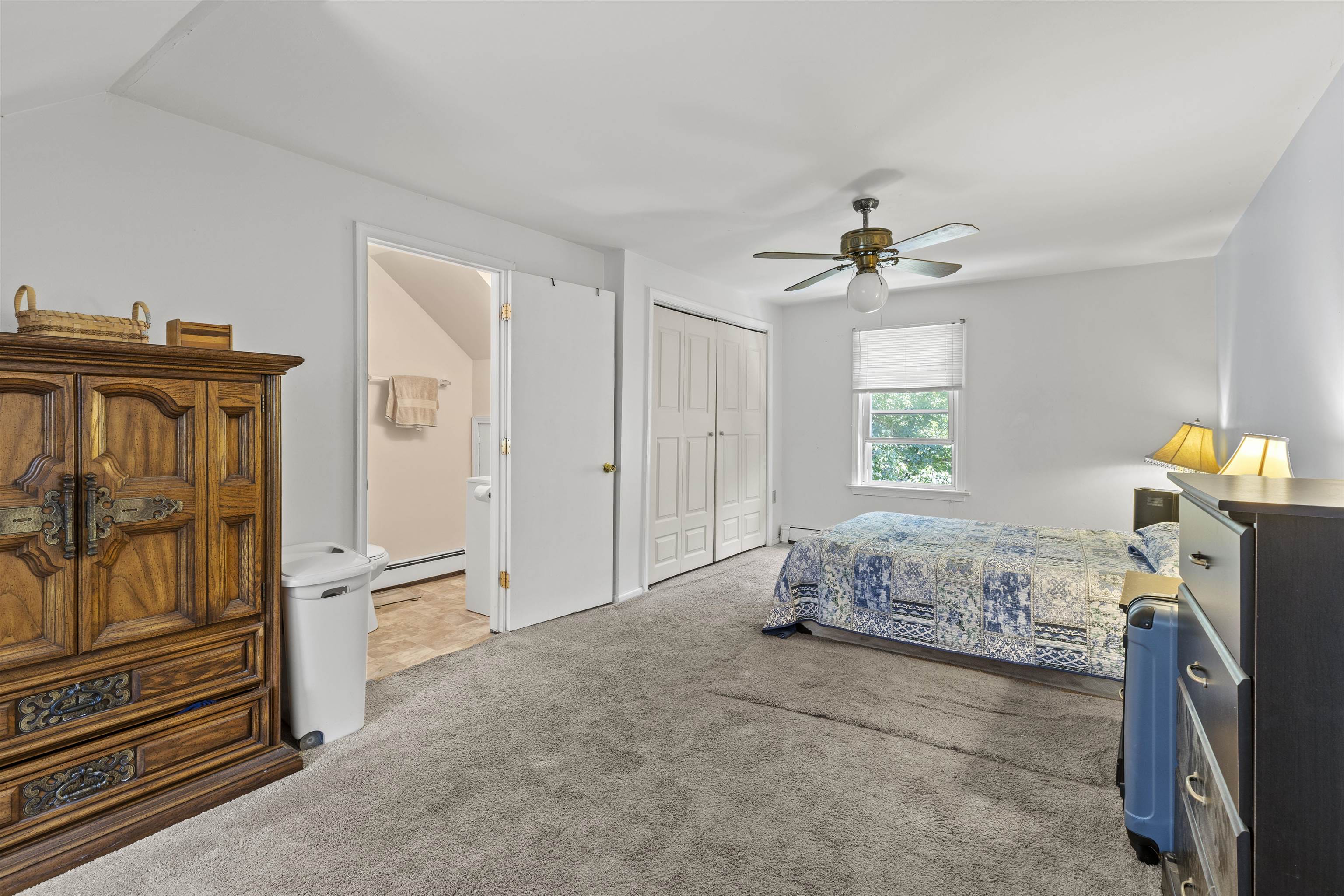 271 Hands Mill Road Belleplain, NJ 08270 - Photo 27 of 50 a bedroom with a bed and a chandelier
