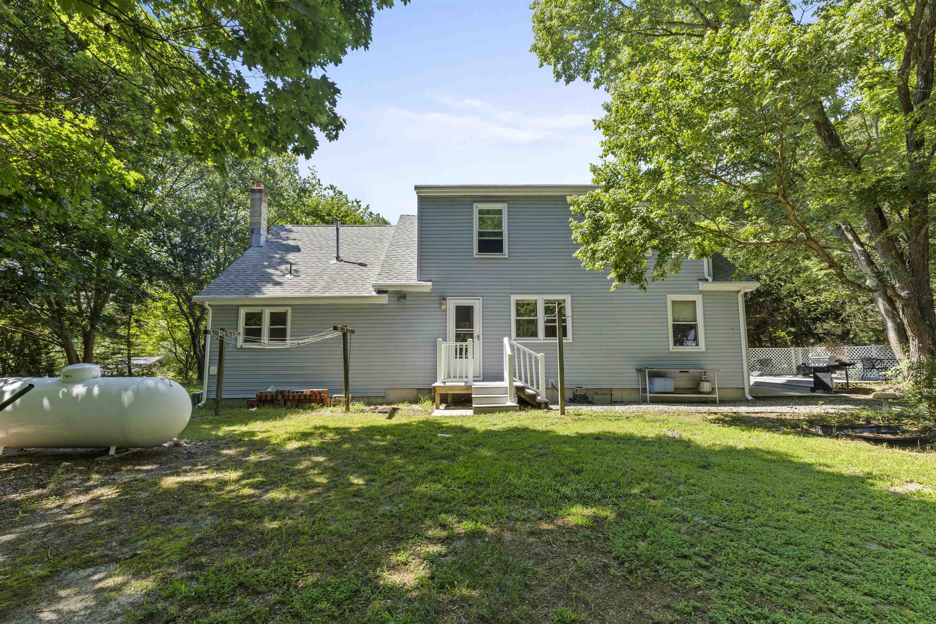 271 Hands Mill Road Belleplain, NJ 08270 - Photo 41 of 50 a front view of house with a garden and trees