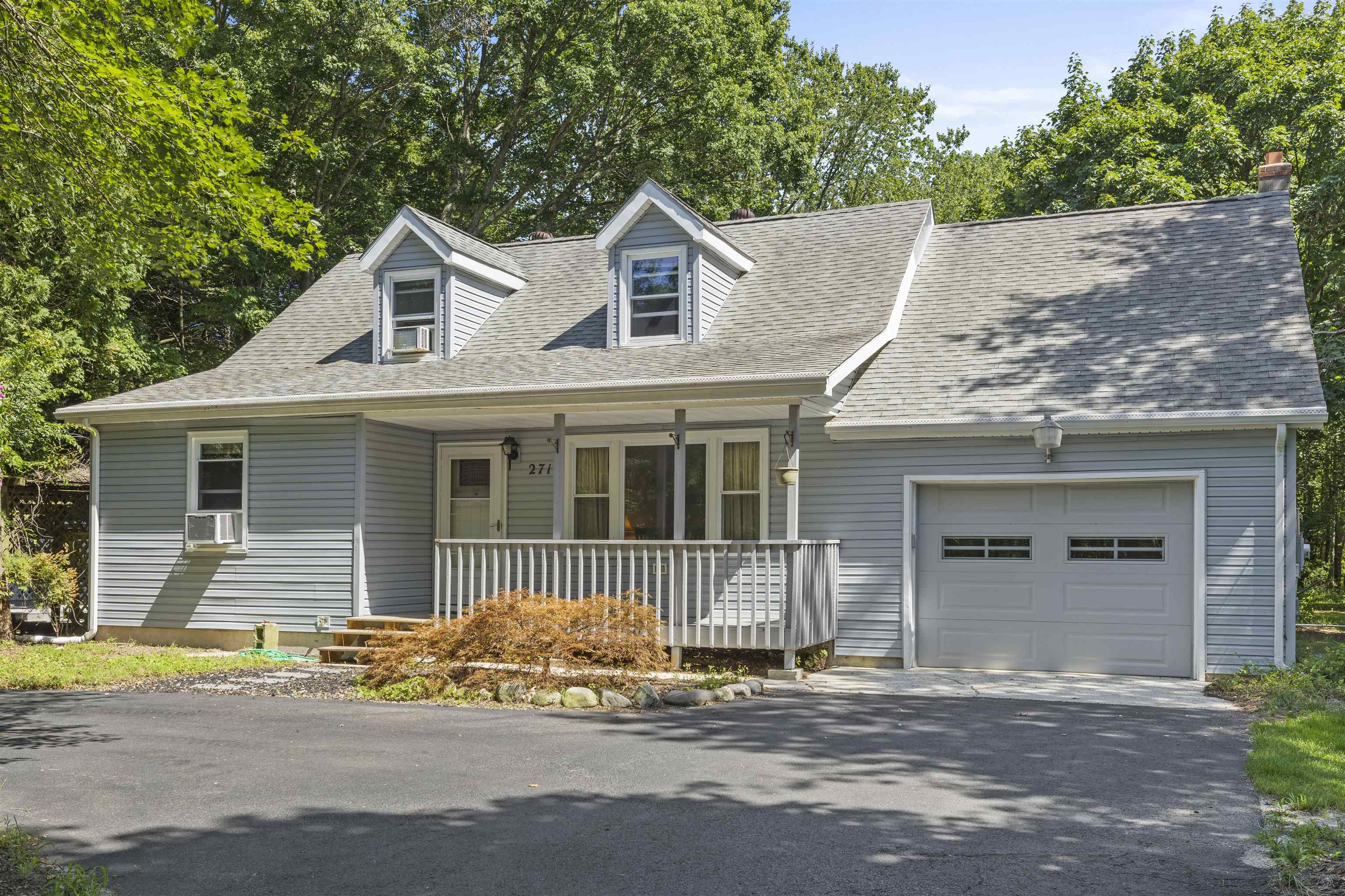 271 Hands Mill Road Belleplain, NJ 08270 - Photo 5 of 50 a front view of a house with a yard and garage