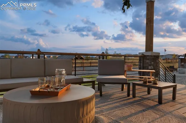 a dining room with furniture a rug and wooden floor