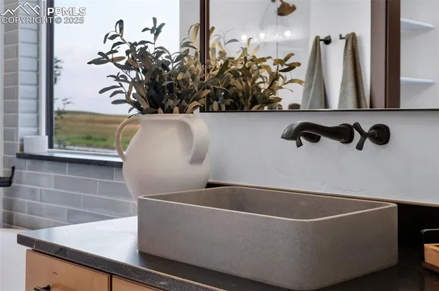 a close view of a sink and a table in a room