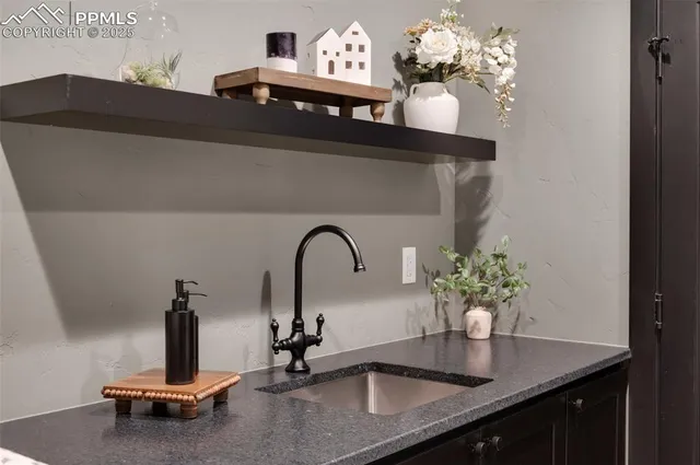 a kitchen with stainless steel appliances granite countertop a kitchen island a stove and a wooden floors