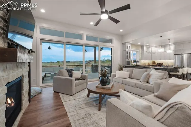 a spacious bedroom with a large bed and a chandelier