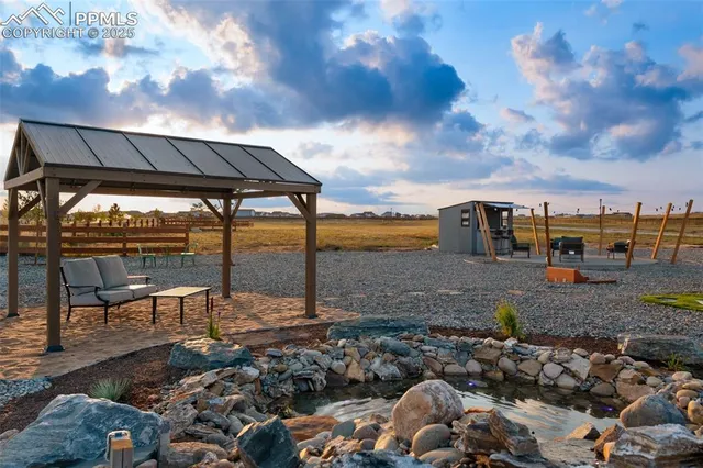 an outdoor space with swimming pool and mountain view