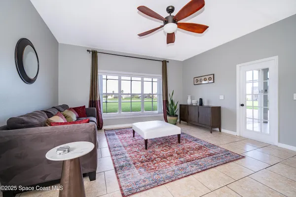 a living room with furniture and a rug