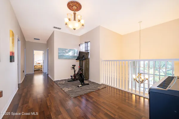 a view of a living room and a wooden floor