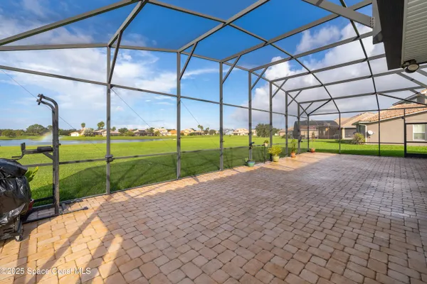 a view of a backyard with table and plants