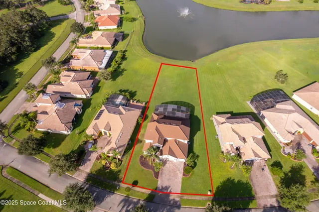 an aerial view of a house with a swimming pool