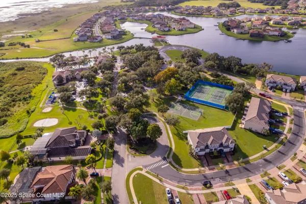 an aerial view of residential houses with outdoor space
