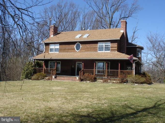 1912 Wilson Road White Hall, MD 21161 - Photo 2 of 29 a house with trees in front of it
