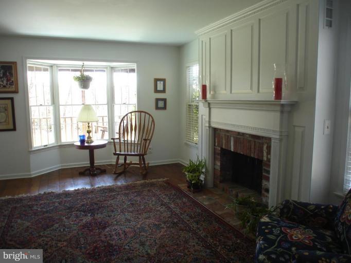 1912 Wilson Road White Hall, MD 21161 - Photo 19 of 29 a living room with furniture and a fireplace
