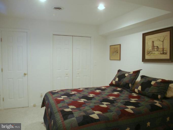 1912 Wilson Road White Hall, MD 21161 - Photo 23 of 29 a bedroom with a bed and wall painting
