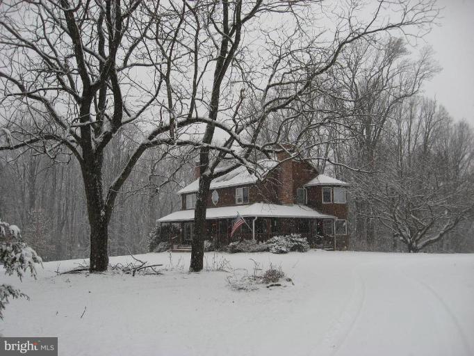 1912 Wilson Road White Hall, MD 21161 - Photo 24 of 29 a view of a house with a snow in the yard