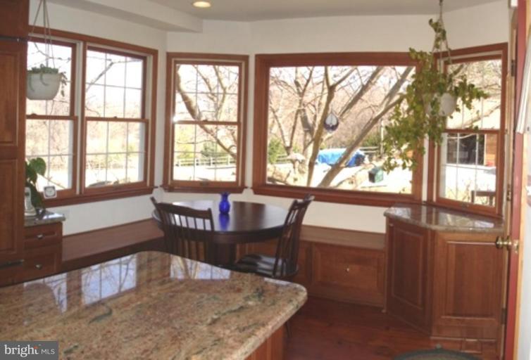 1912 Wilson Road White Hall, MD 21161 - Photo 9 of 29 a view of a dining room with furniture window and outside view