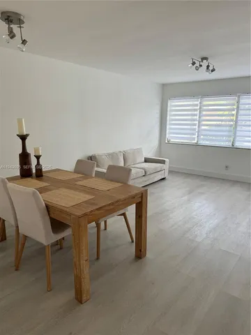 a dining room with a table and chairs