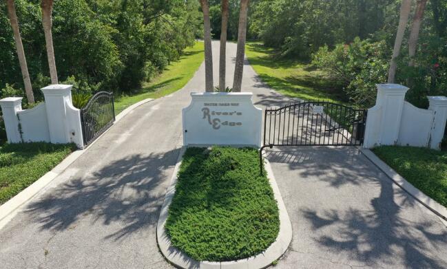 135 Water Oaks Way Apalachicola, FL 32320 - Photo 4 of 8 a view of a garden with pathway