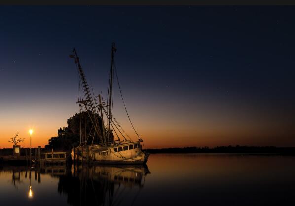135 Water Oaks Way Apalachicola, FL 32320 - Photo 5 of 8 a view of a lake from a balcony