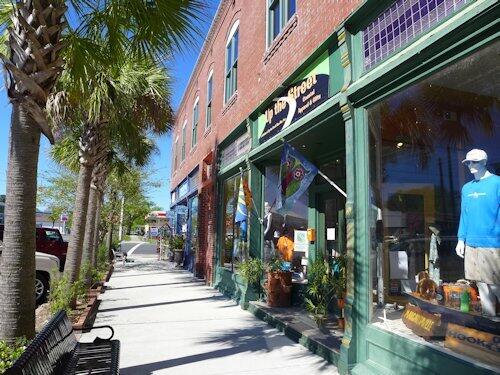 135 Water Oaks Way Apalachicola, FL 32320 - Photo 7 of 8 a view of path along with retail shop and buildings