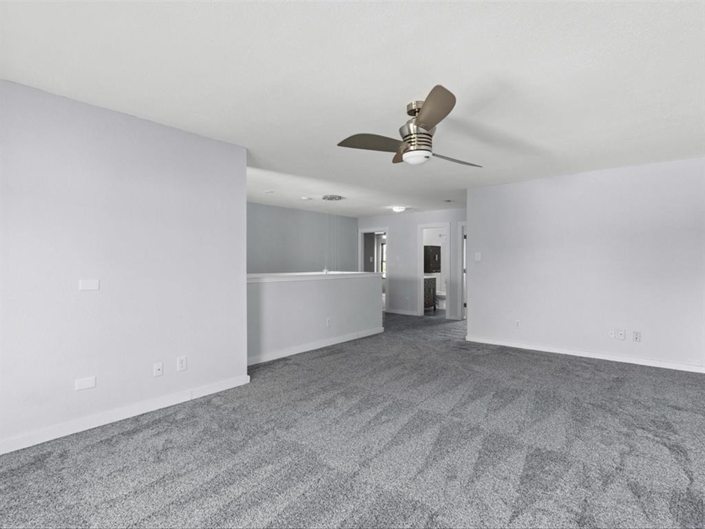 5304 Los Altos Road Fort Worth, TX 76244 - Photo 26 of 30 Empty room with ceiling fan and carpet flooring