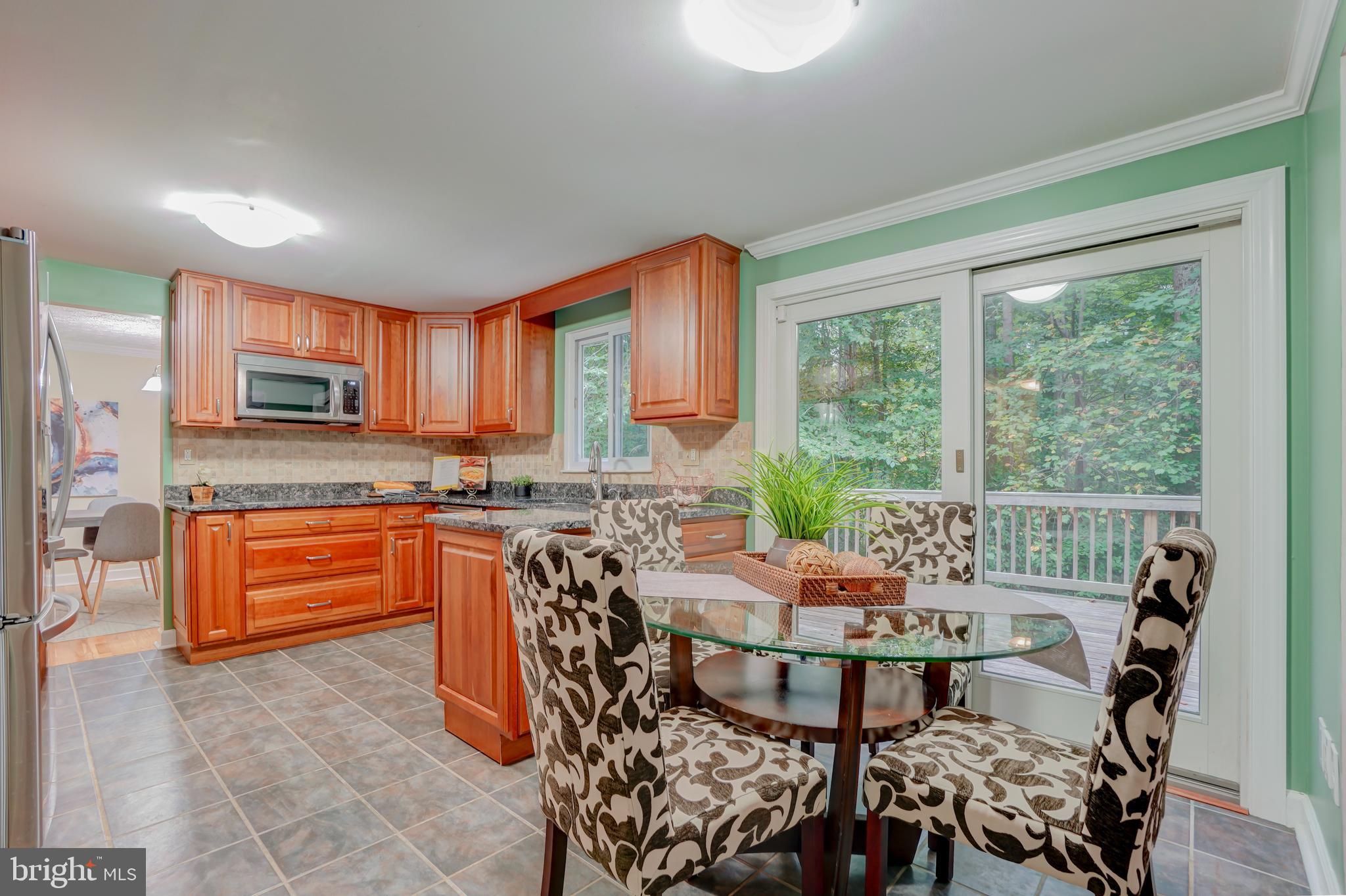 8843 Woodlawn Way Springfield, VA 22153 - Photo 13 of 45 Open Eat In Kitchen with view of deck and trees