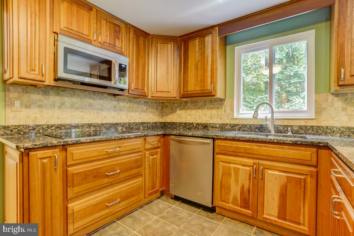 8843 Woodlawn Way Springfield, VA 22153 - Photo 14 of 45 Kitchen has lots of storage and real wood cabinets