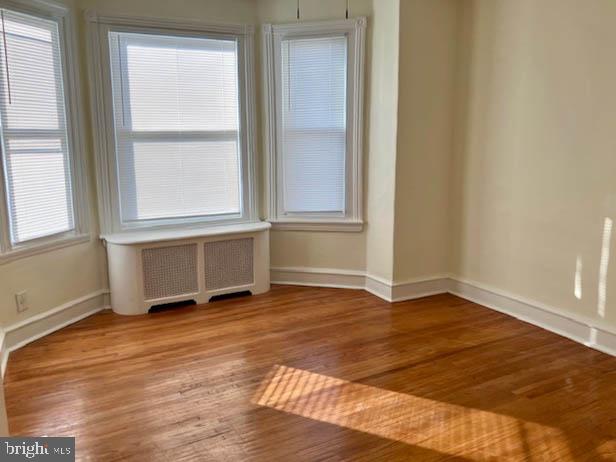 543 North Simpson Street Philadelphia, PA 19151 - Photo 3 of 11 Sunlit corner with warm hardwood floors.