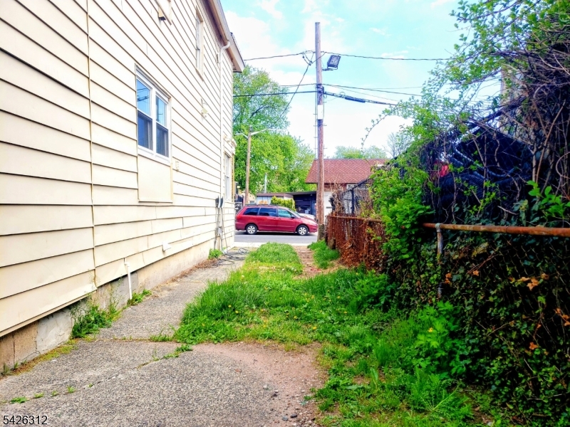 215 Lafayette Street Orange, NJ 07050 - Photo 14 of 14 a view of a backyard with plants