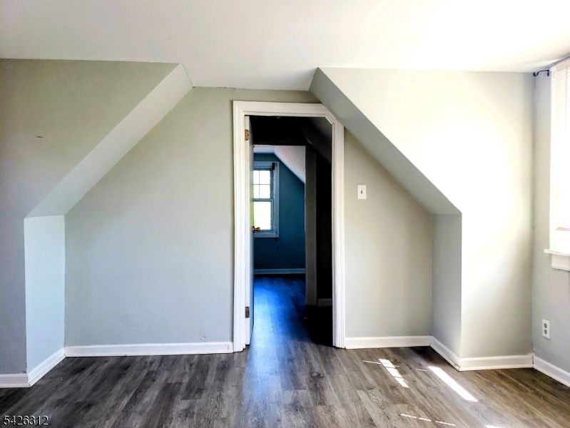215 Lafayette Street Orange, NJ 07050 - Photo 8 of 14 a view of hallway with wooden floor