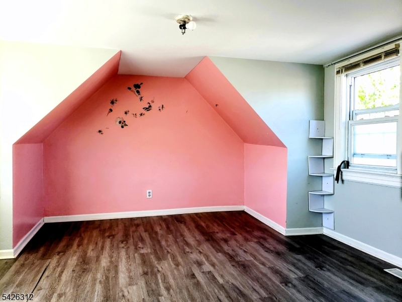 215 Lafayette Street Orange, NJ 07050 - Photo 9 of 14 a view of a room with wooden floor