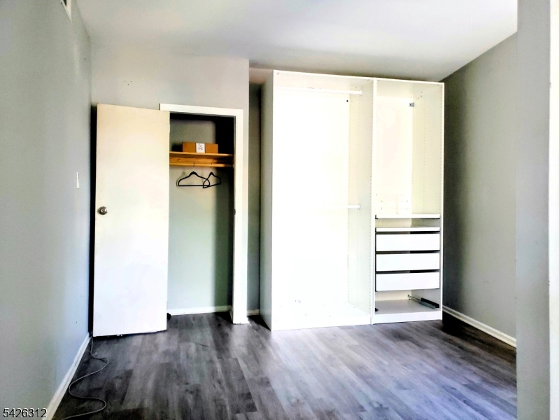215 Lafayette Street Orange, NJ 07050 - Photo 10 of 14 a view of a hallway with wooden floor